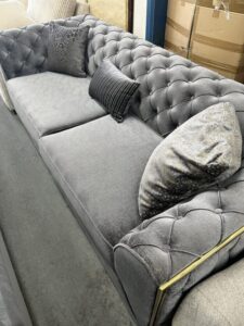 Luxurious Grey Tufted Chesterfield Sofa with Gold Accents