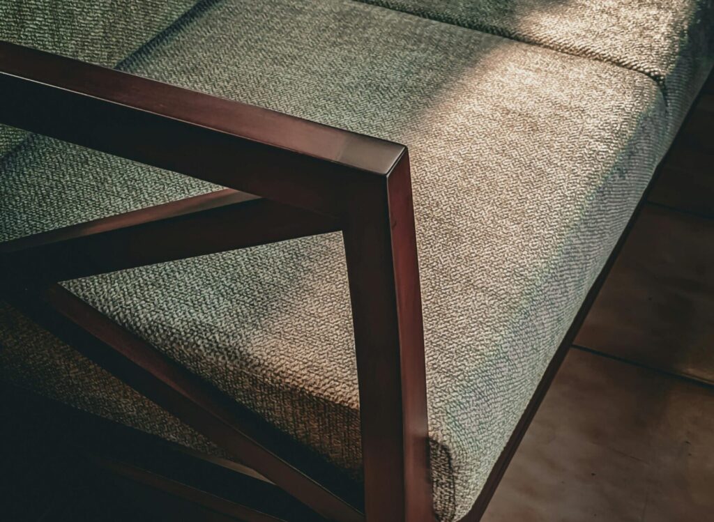 Mid century modern sofa with tapered wooden legs in a warm Canadian living room