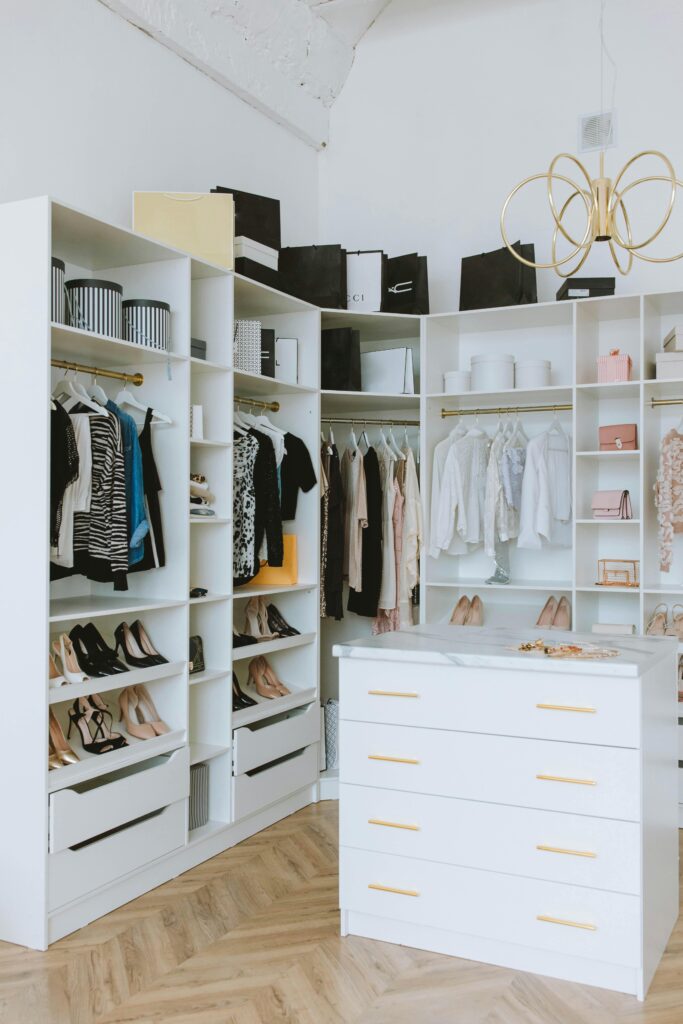 Best wardrobe for small bedroom no closet Canada showing a tall narrow white wardrobe in a minimal Canadian bedroom with hardwood floors