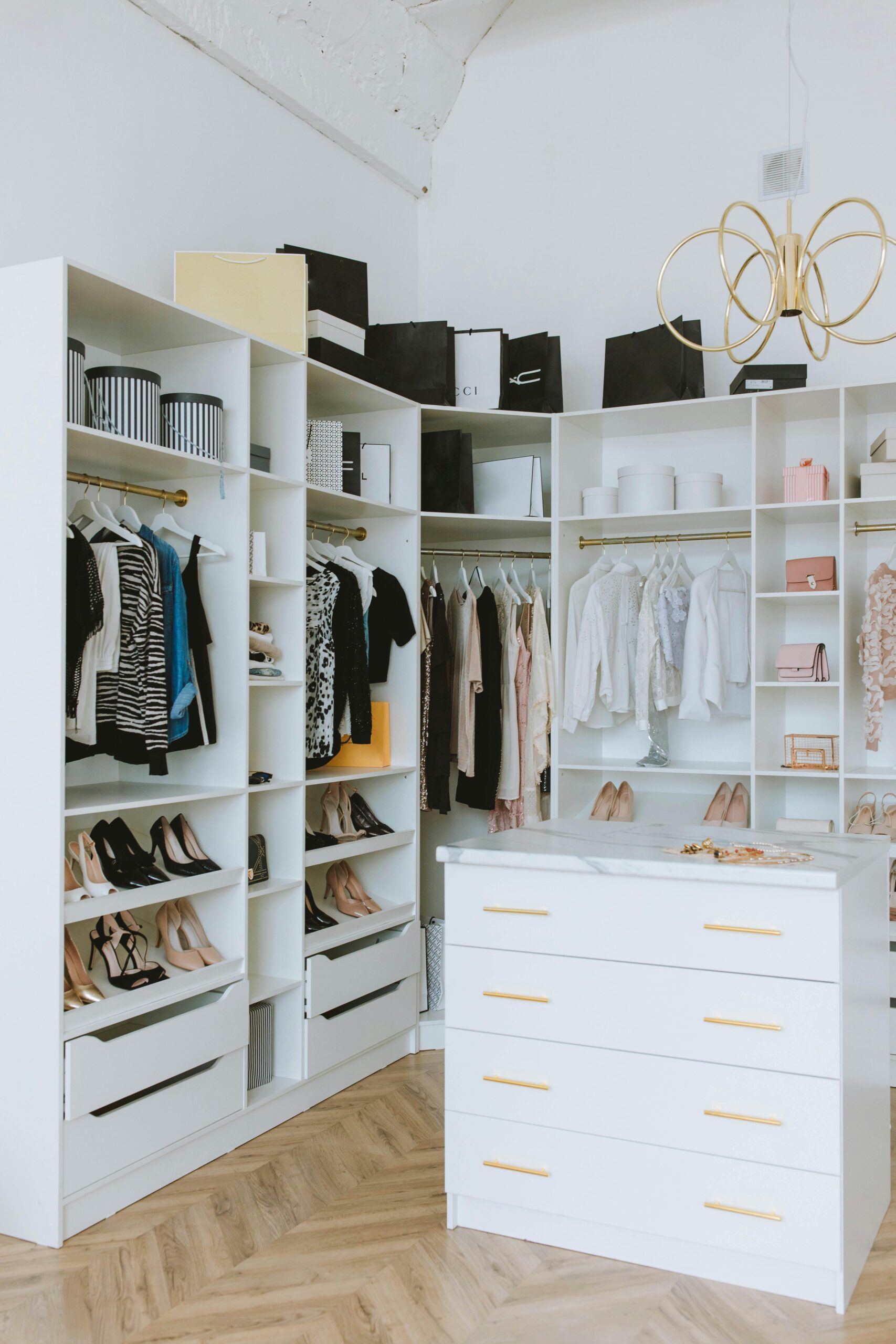 Best wardrobe for small bedroom no closet Canada showing a tall narrow white wardrobe in a minimal Canadian bedroom with hardwood floors