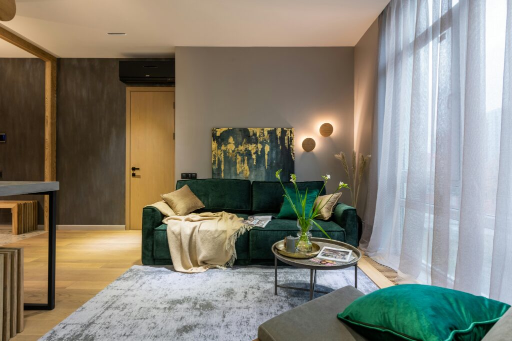 What size sofa fits a small apartment showing a compact loveseat in a bright 400 square foot Canadian apartment living area