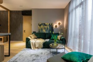What size sofa fits a small apartment showing a compact loveseat in a bright 400 square foot Canadian apartment living area