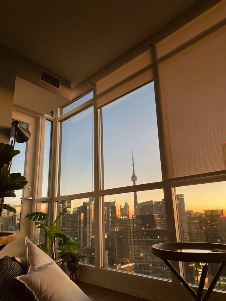 How to furnish a condo living room in Toronto with a compact sofa coffee table and open layout without feeling crowded