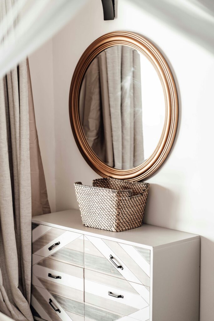 Best dresser for small bedroom Canada showing a tall narrow oak six drawer dresser in a bright minimal Canadian bedroom