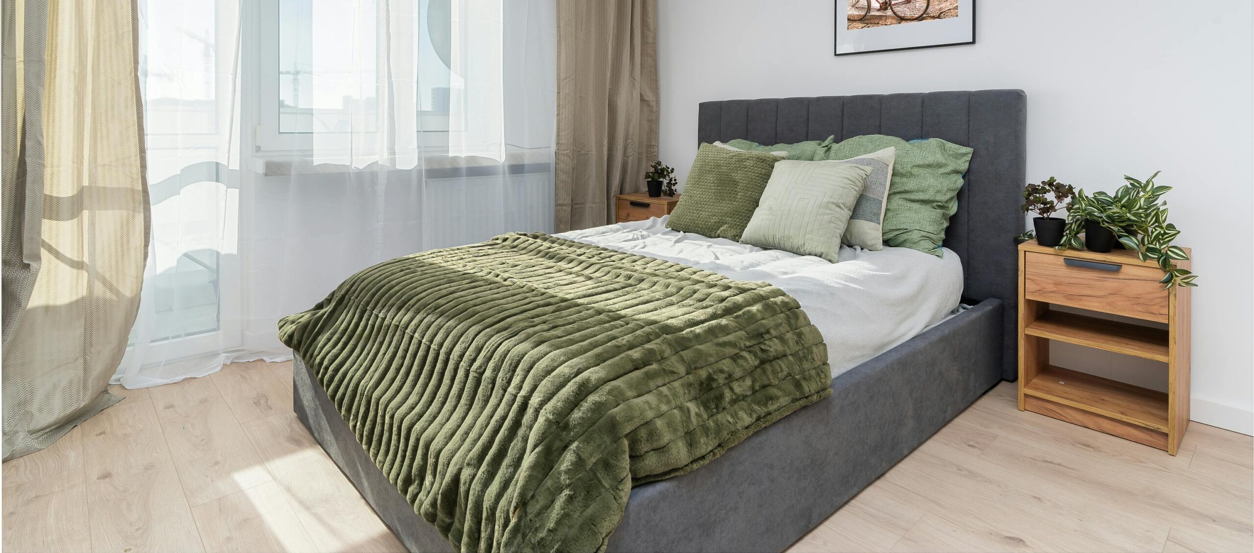 Small bedroom furniture ideas for Toronto apartments showing a compact bed with storage and floating nightstands in a modern condo