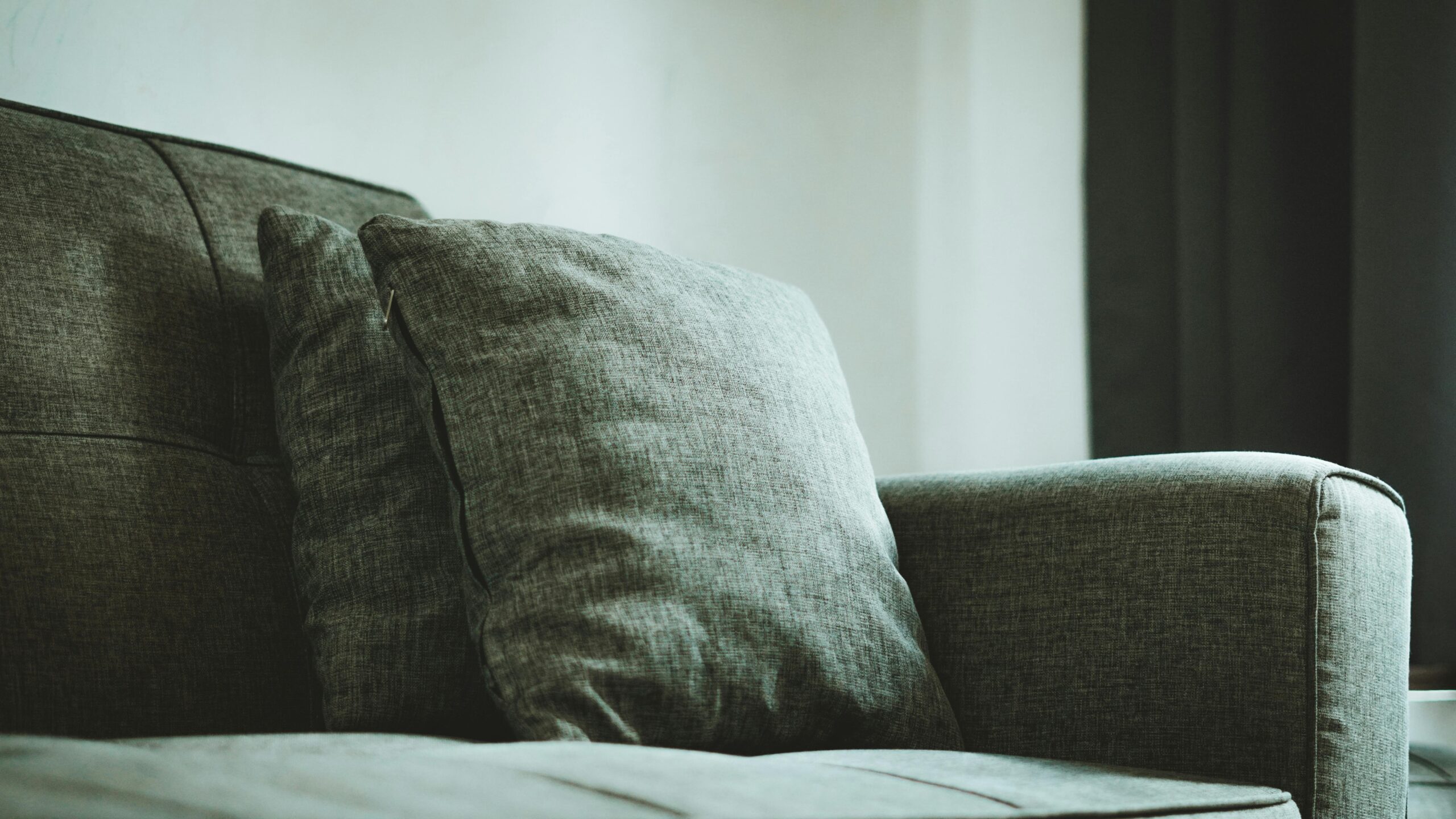 Best sofa for small condo Canada displayed in a bright minimalist Toronto apartment living room with natural light